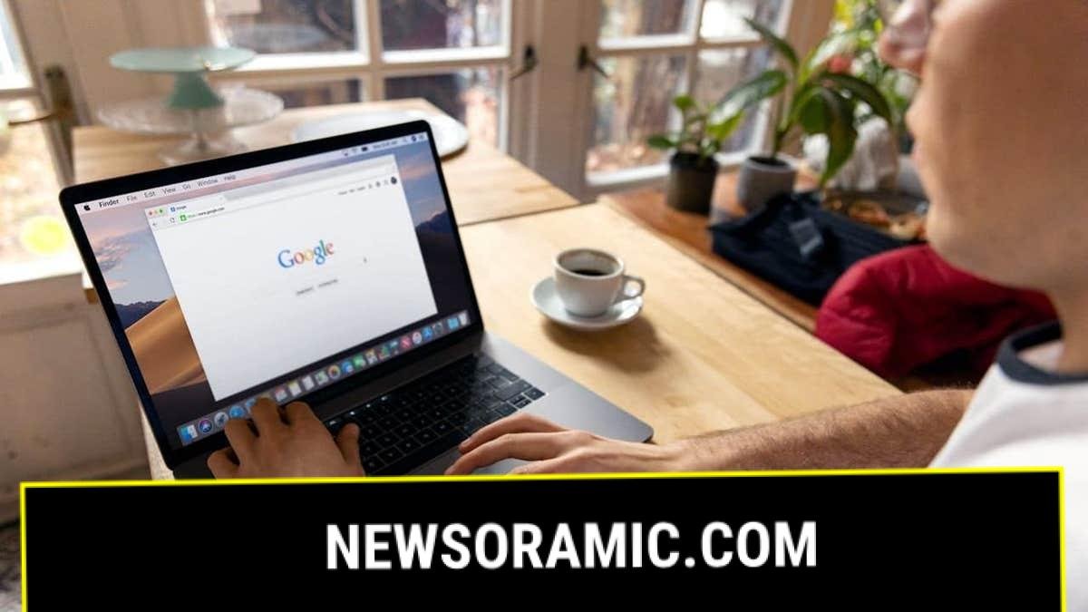 A man conducting a Google search on a laptop.