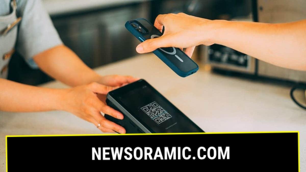 Making a payment by scanning a QR code with a phone.