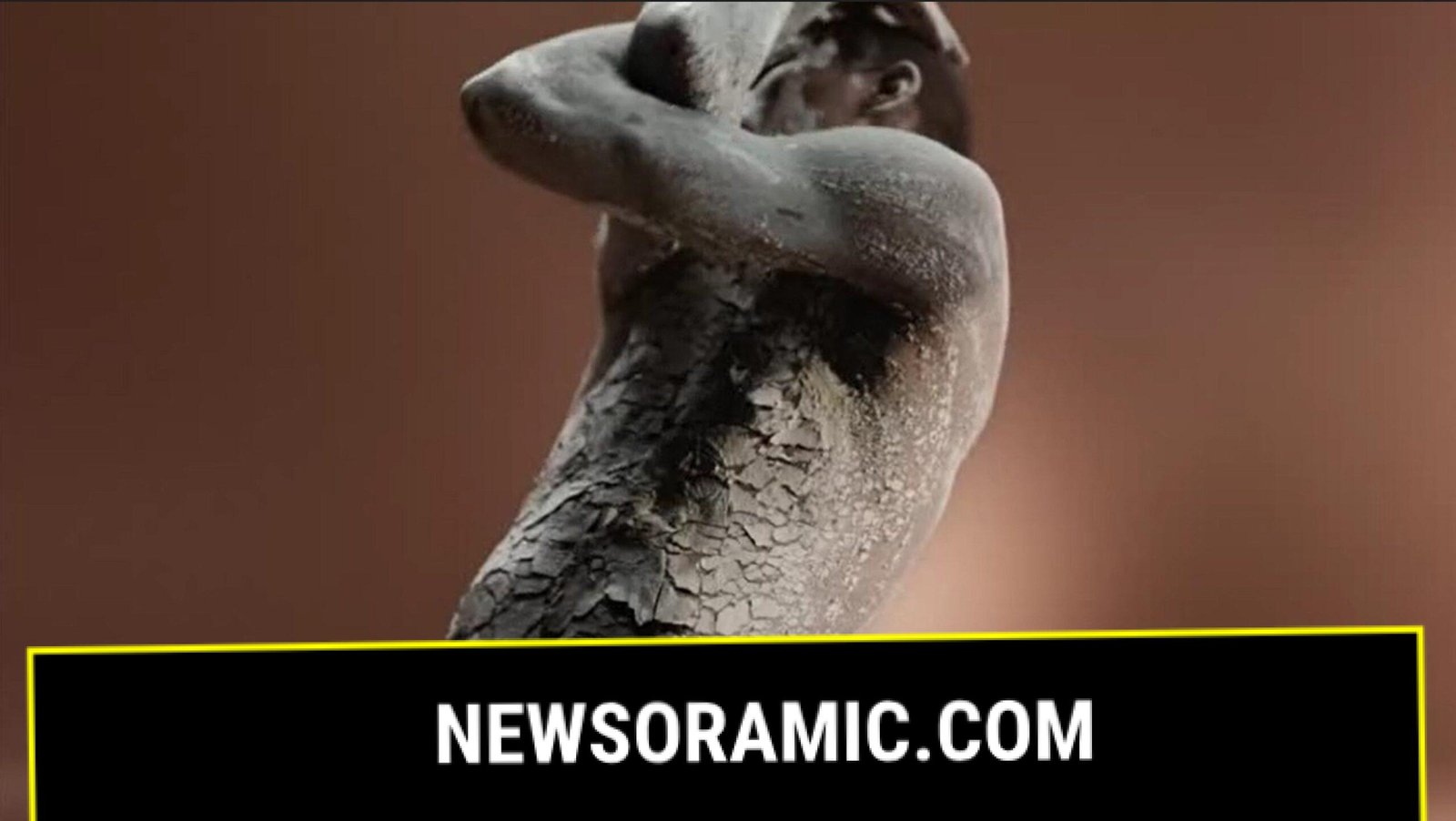 In one section a black woman was shown covered in a cracked, clay-like material