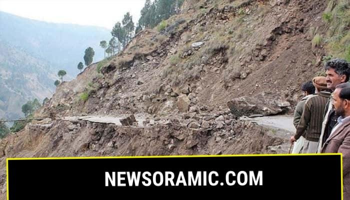 This undated picture shows people standing near a landslide site at an undisclosed location. — Geo Tv/File