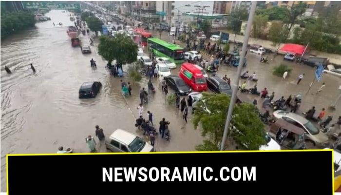 Cars stranded on the road after heavy rains submerged roads in Karachi on August 19, 2025. — Geo News