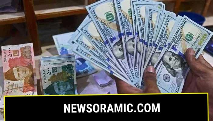 A foreign currency dealer counts US dollars at a shop in Karachi on May 19, 2022. — AFP/File