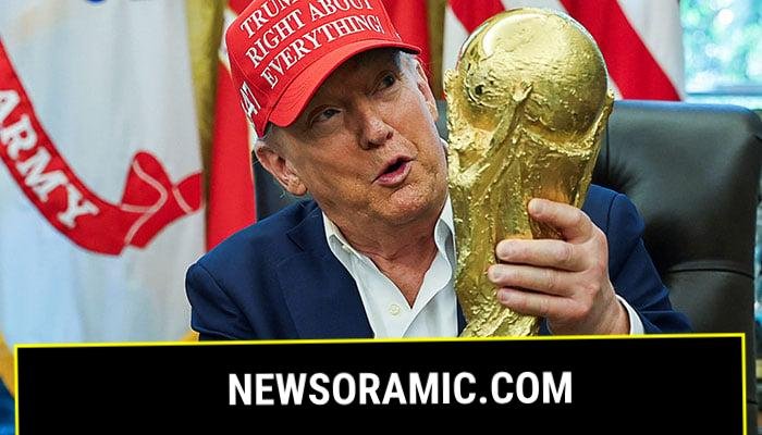 US President Donald Trump wears a Trump Was Right About Everything! hat while holding the FIFA World Cup Trophy, as he makes an announcement on the 2026 FIFA World Cup, in the Oval Office at the White House in Washington, DC, US, August 22, 2025. — Reuters