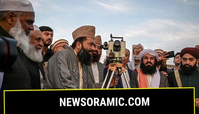 Central Ruet-e-Hilal Committee Chairman Maulana Abdul Khabeer Azad, surrounded by religious scholars and clerics, looks in the telescope to spot the crescent moon in this undated image. — AFP/File