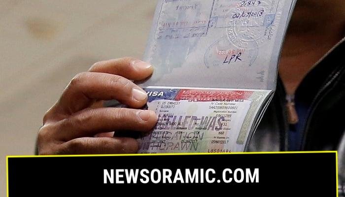 A traveller shows the cancelled visa in his passport to reporters at Washington Dulles International Airport in Chantilly, Virginia, US, February 6, 2017.—Reuters