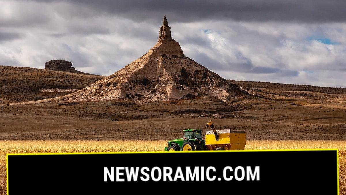 Tractor in cornfield at Scotts Bluff, Nebraska