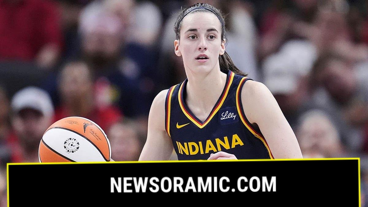 Caitlin Clark dribbles