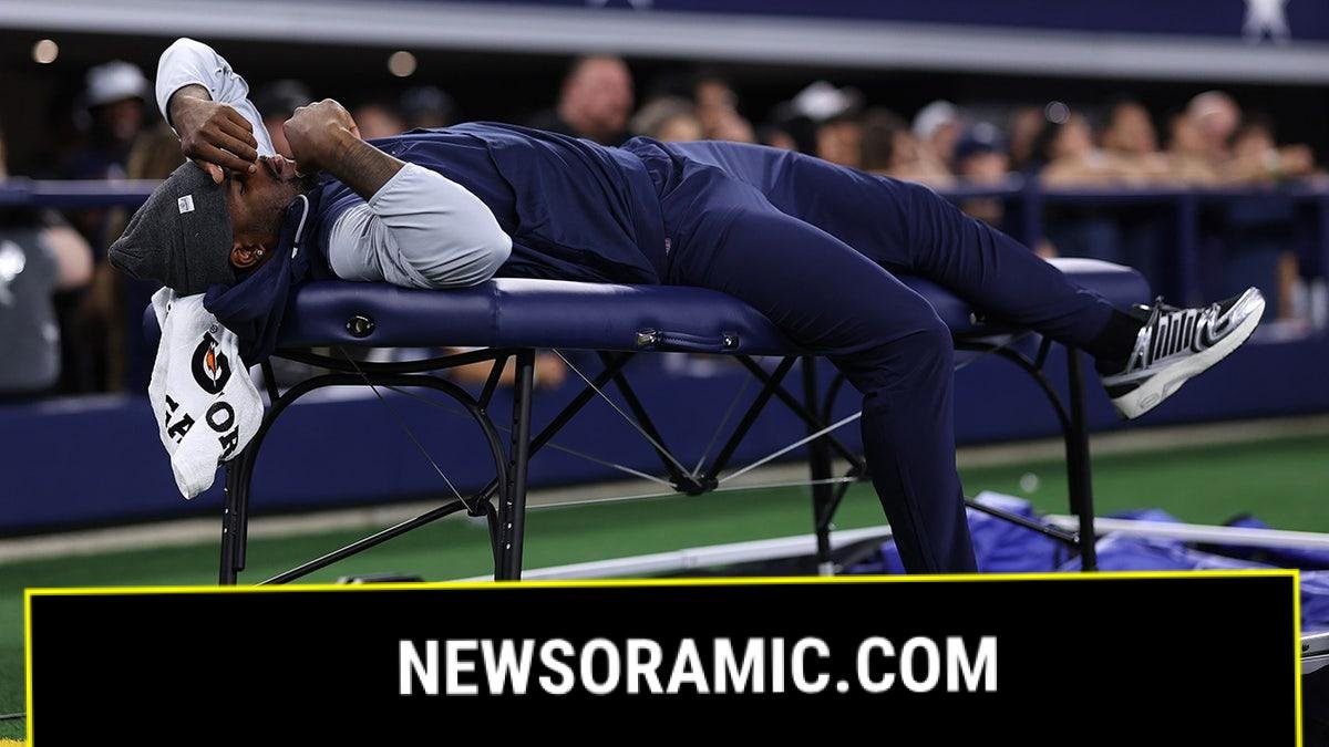 Micah Parsons lays on the training table