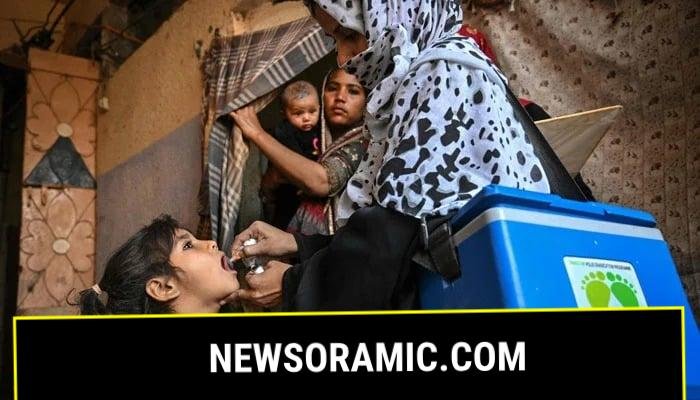 A health worker administers polio drops to a child on the first day of a nationwide polio vaccination campaign, in Karachi on February 3, 2025. — AFP