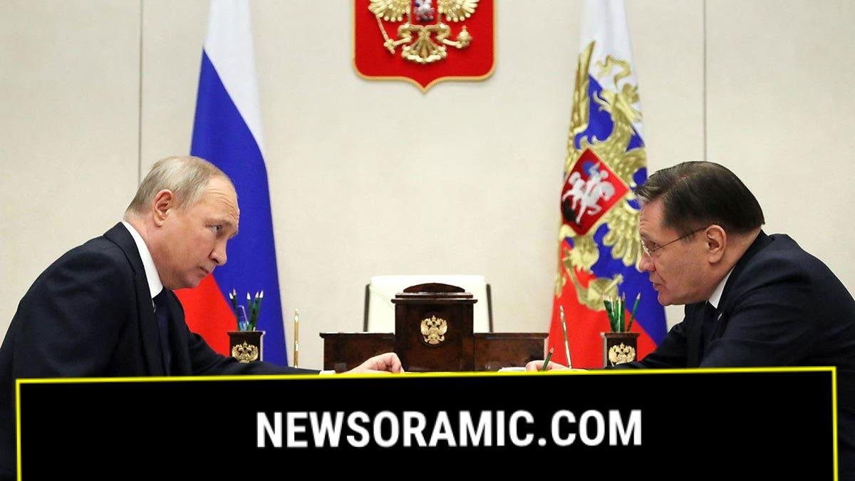 Putin sits with Rosatom's Alexey Likhachev