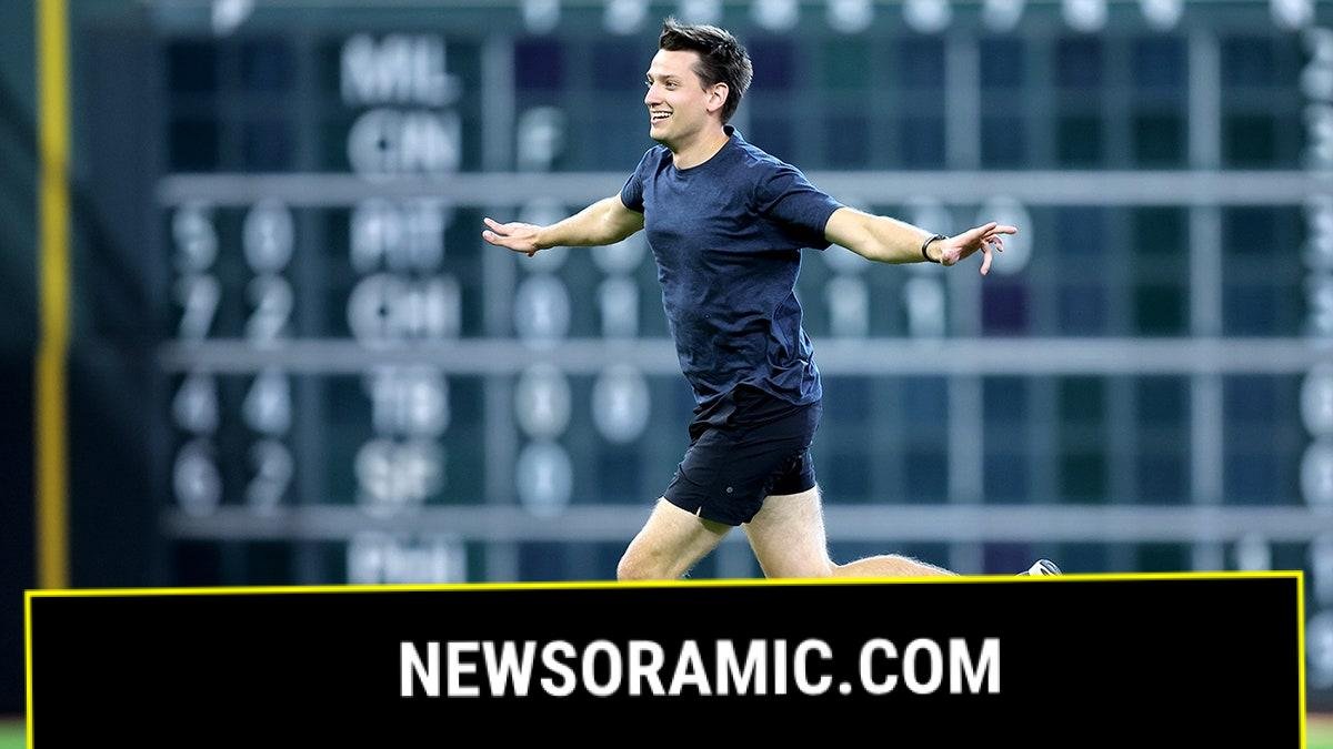 A fan runs on the field at Daikin Field