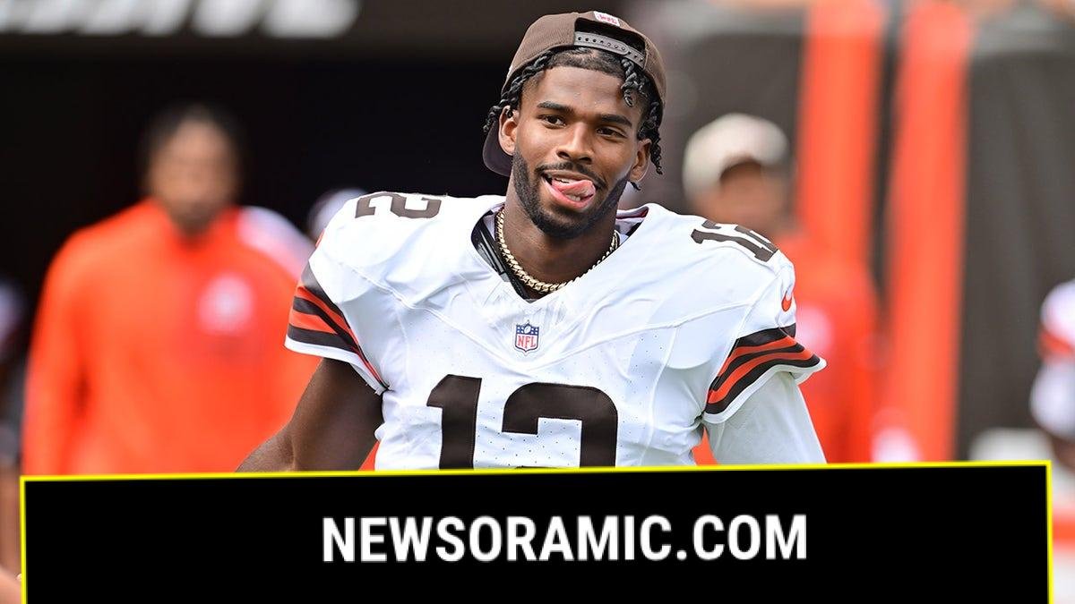 Shedeur Sanders runs out onto the field