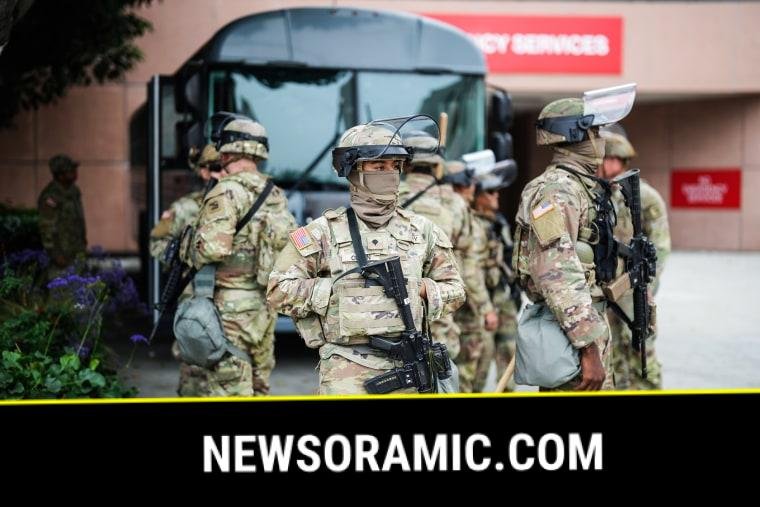 National Guard stand outside