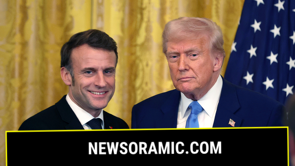 Macron shakes hands with Trump