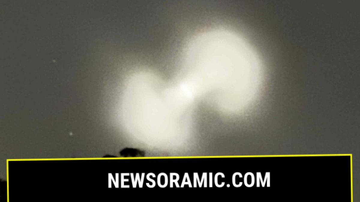 Pill-shaped orb in darkened sky