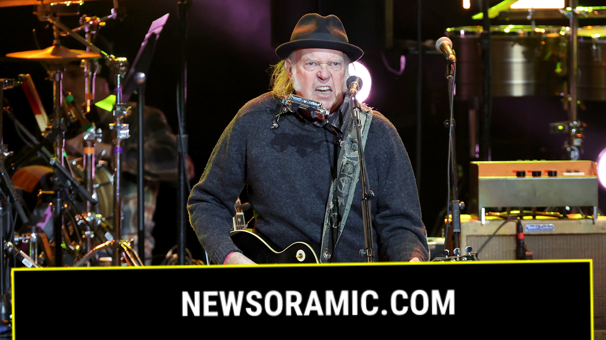 Neil Young performs on stage
