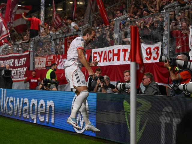 bayern munich striker harry kane celebrates with fans after scoring a stoppage time winner in the first minute of the german cup