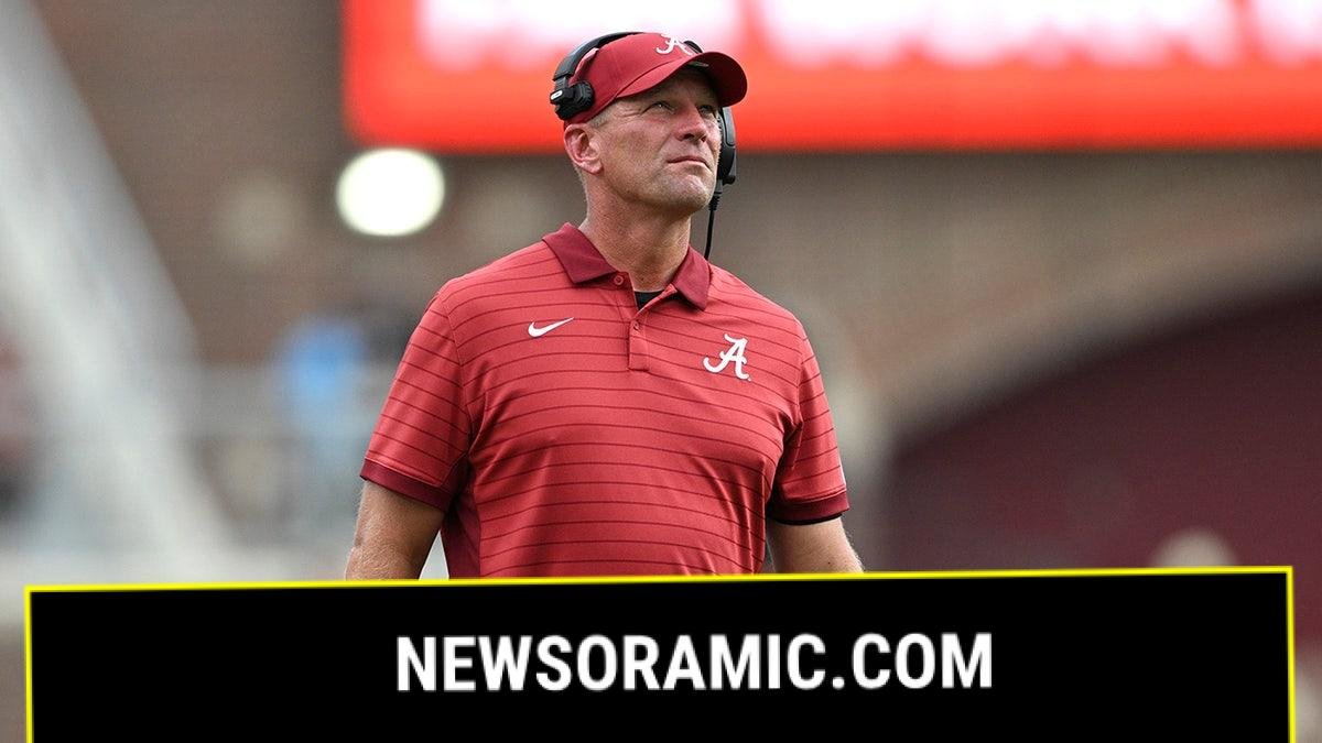 Kalen DeBoer coaches a college football game