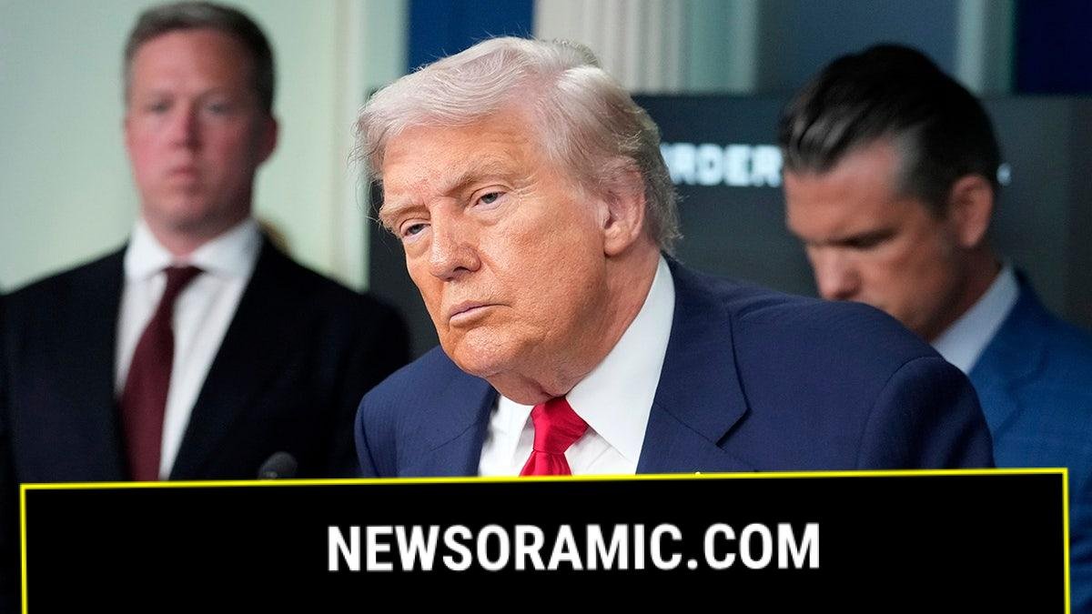 Donald Trump talks to the media