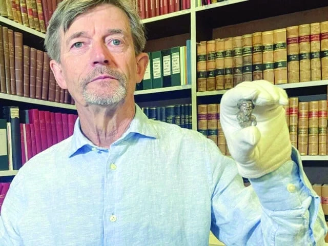 denmark s national museum curator peter pentz holds up an old figurine photo afp