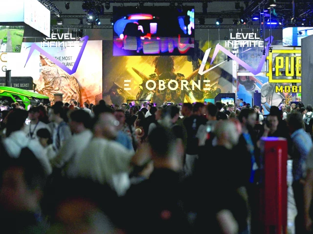 visitors are seen at the gamescom video games trade fair in cologne western germany photo afp