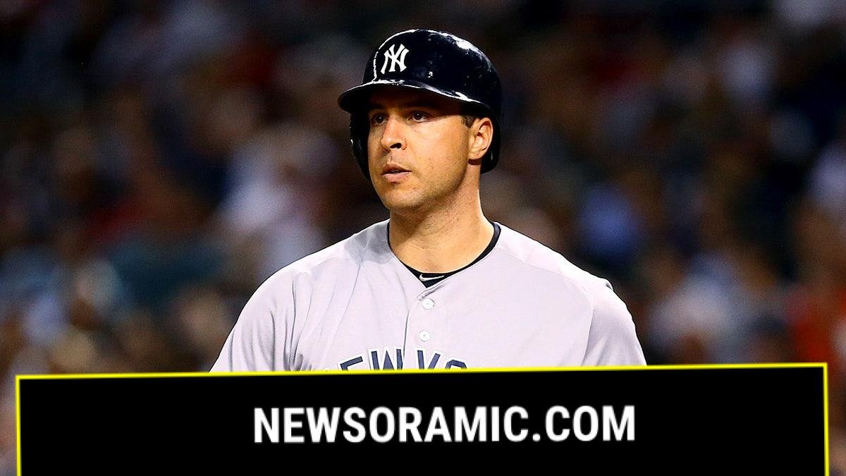 Mark Teixeira looks on