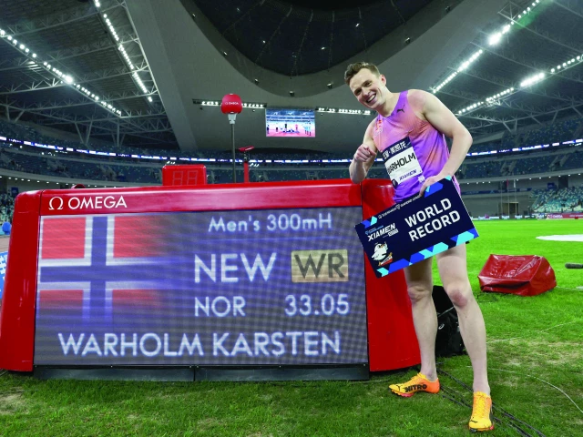 norway s karsten warholm celebrates after setting a new world record in the men s 300m hurdles at the athletics diamond league at xiamen egret stadium xiamen china on april 26 photo reuters