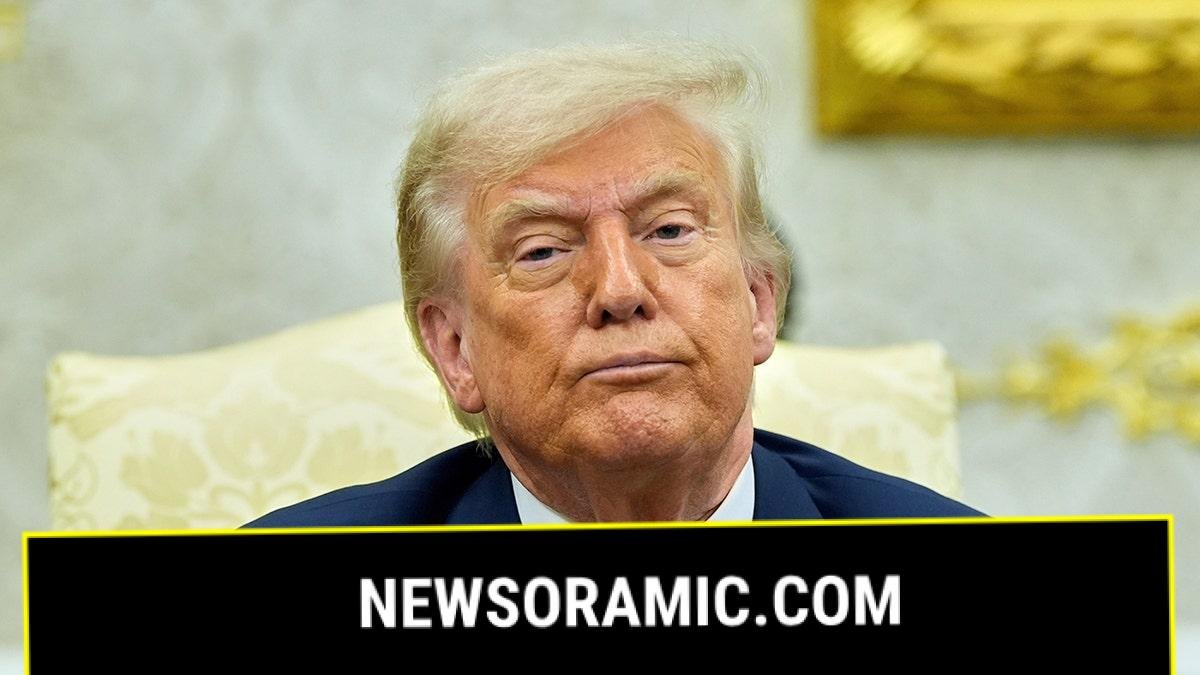 Trump in the Oval Office with a serious face