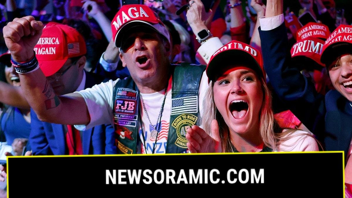 young Trump supporters in MAGA hats clapping