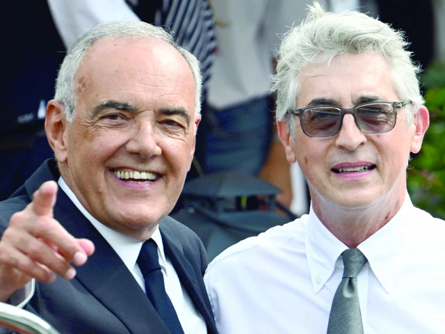 director of venice film festival alberto barbera l and the president of the jury us film director alexander payne arrive at the excelsior pier on the eve of the 82nd venice international film festival at venice lido photo afp