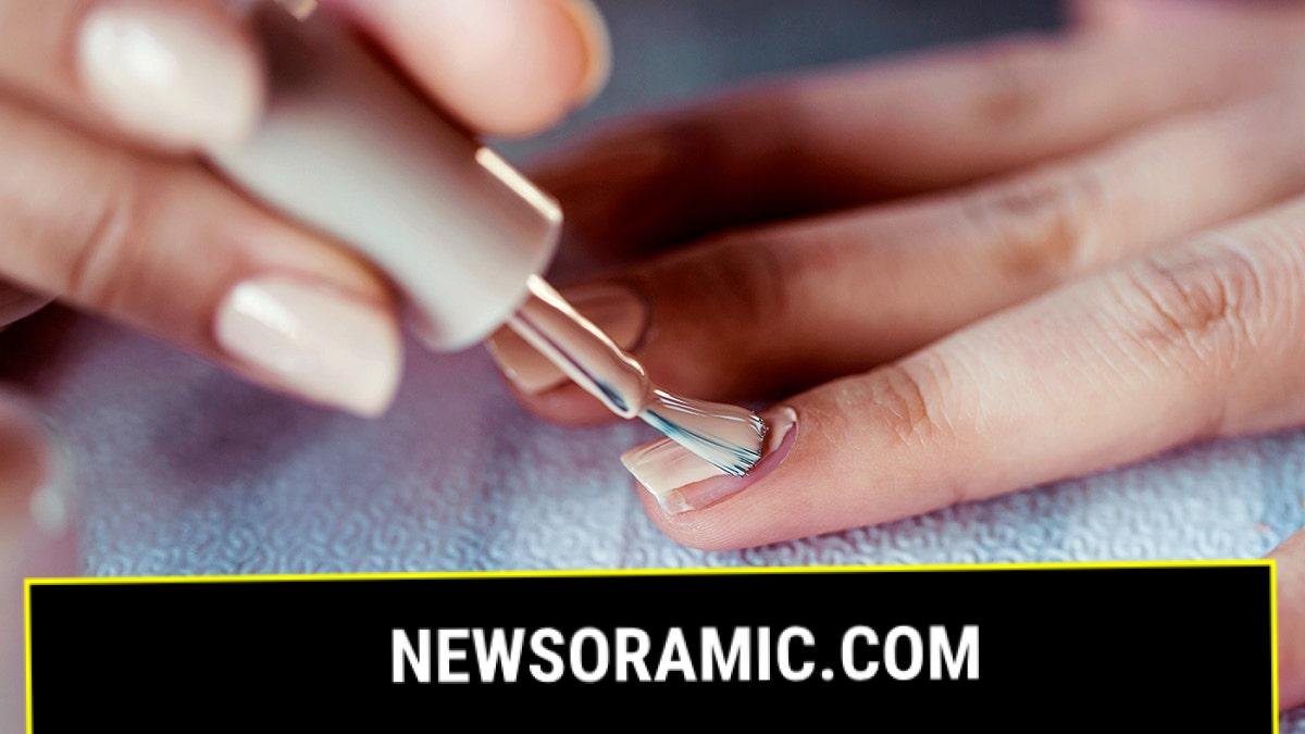 Beautiful manicured woman's nails with cream nail