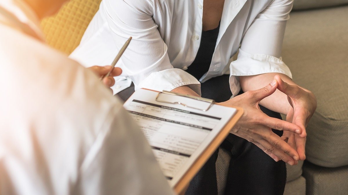 doctor questions new patient