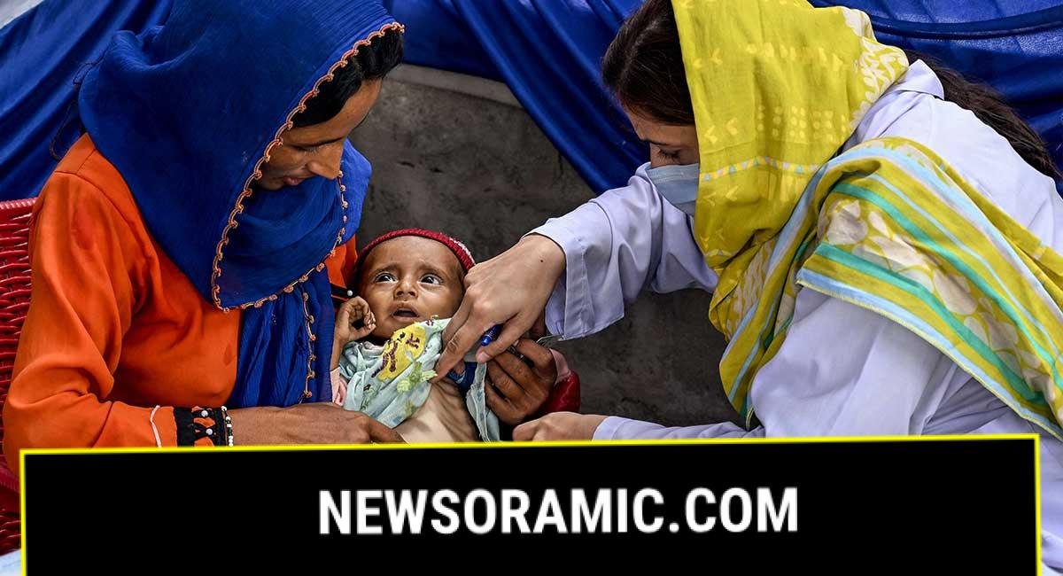 This photograph taken on July 29, 2025 shows a female doctor (R) examining a child during a UNICEF nutrition programme at Fateh Muhammad Soomro village in the Sujawal district of Sindh. — AFP