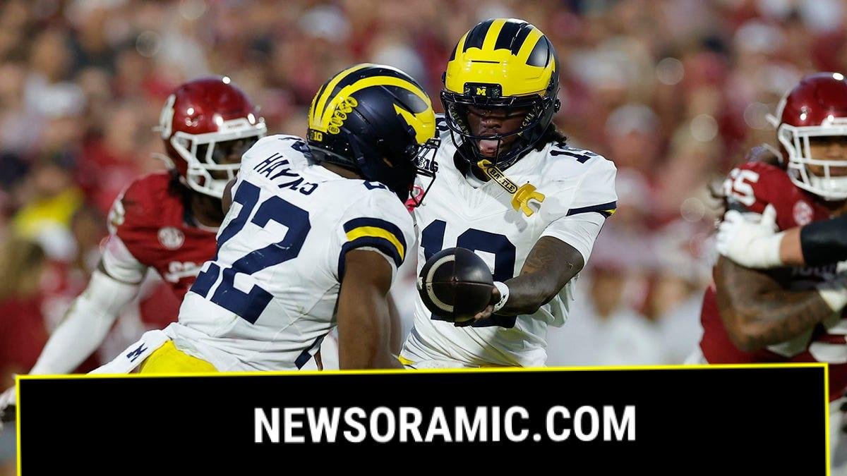 Bryce Underwood hands the ball off