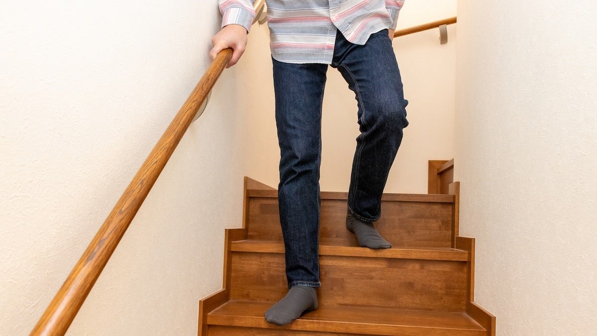 Man walking down stairs