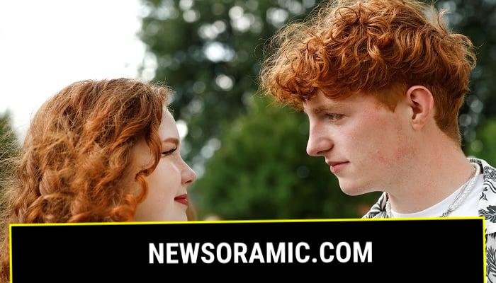 A boy looks at a girl, both from Germany, as they attend the annual Redhead Days Festival in Tilburg, Netherlands, August 27, 2023. REUTERS