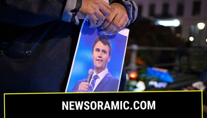 A man holds a picture of Charlie Kirk during a vigil under the line In Memory of Charlie Kirk, for freedom, patriotism and justice in front of the Embassy of the United States after US right-wing activist, commentator, Charlie Kirk, an ally of US President Donald Trump, was shot dead during an event at Utah Valley University, Orem, US, in Berlin, Germany September 11, 2025.— Reuters