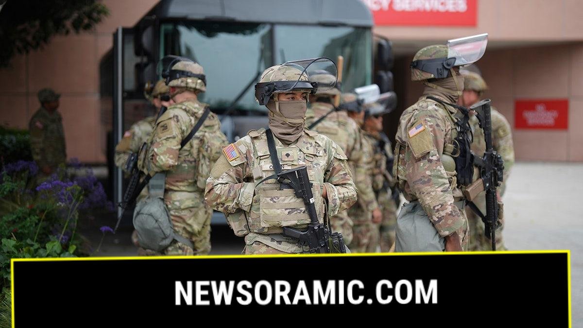 U.S. National Guard walking by vehicle
