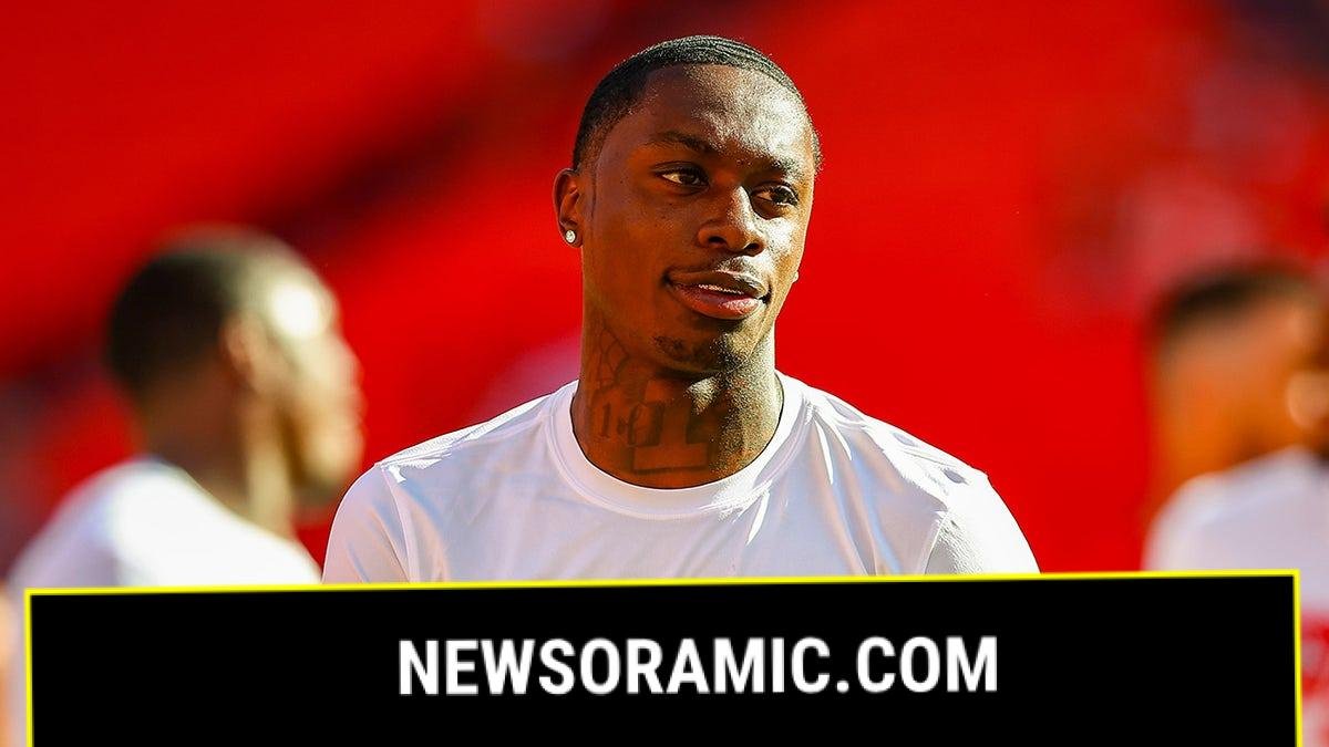 Xavier Worthy looks on during pregame