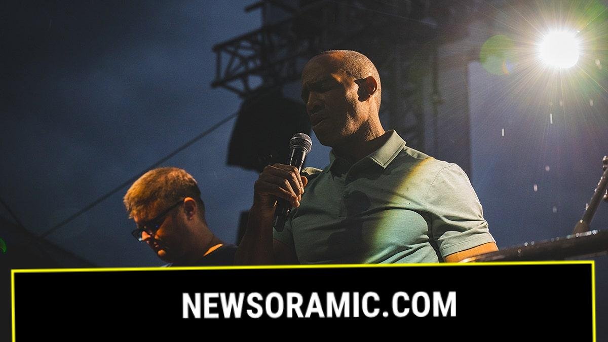 HUD Secretary Scott Turner prays in the rain during HUD’s faith-based disaster recovery event on the National Mall.
