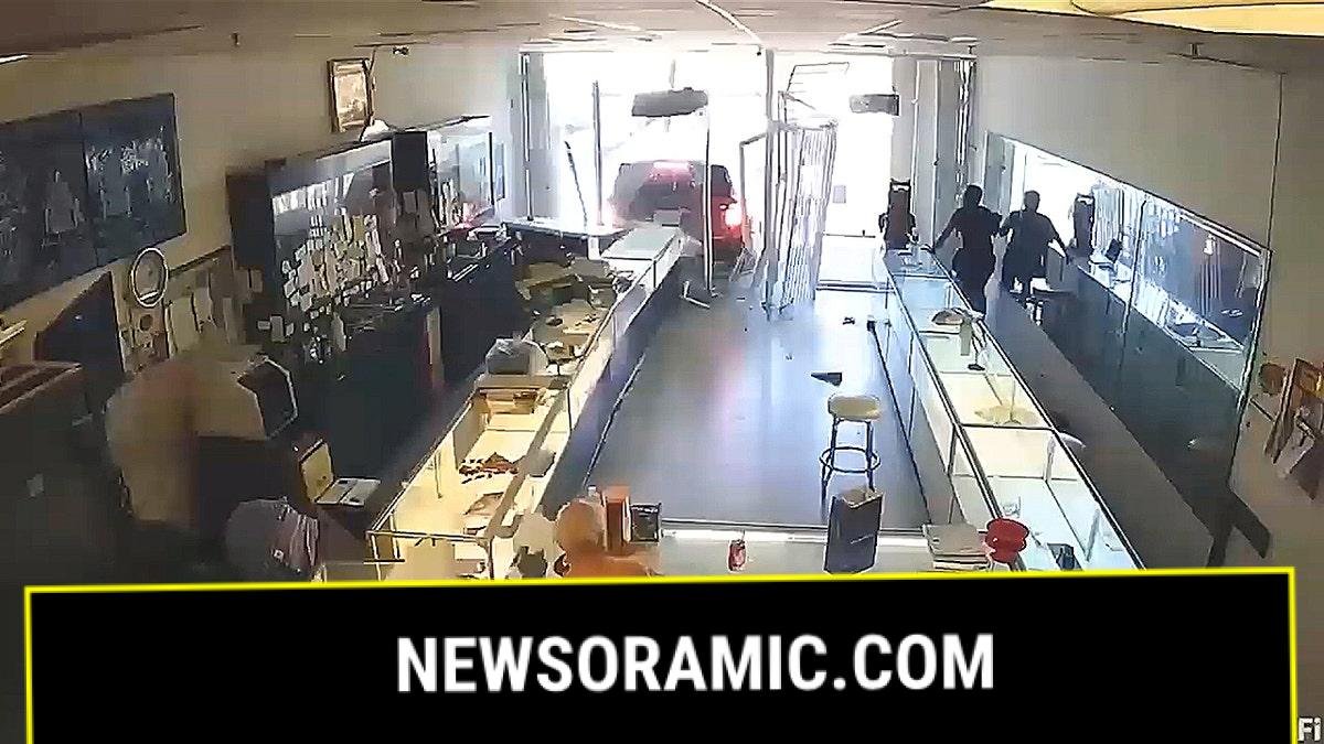 SUV backed into jewelry store