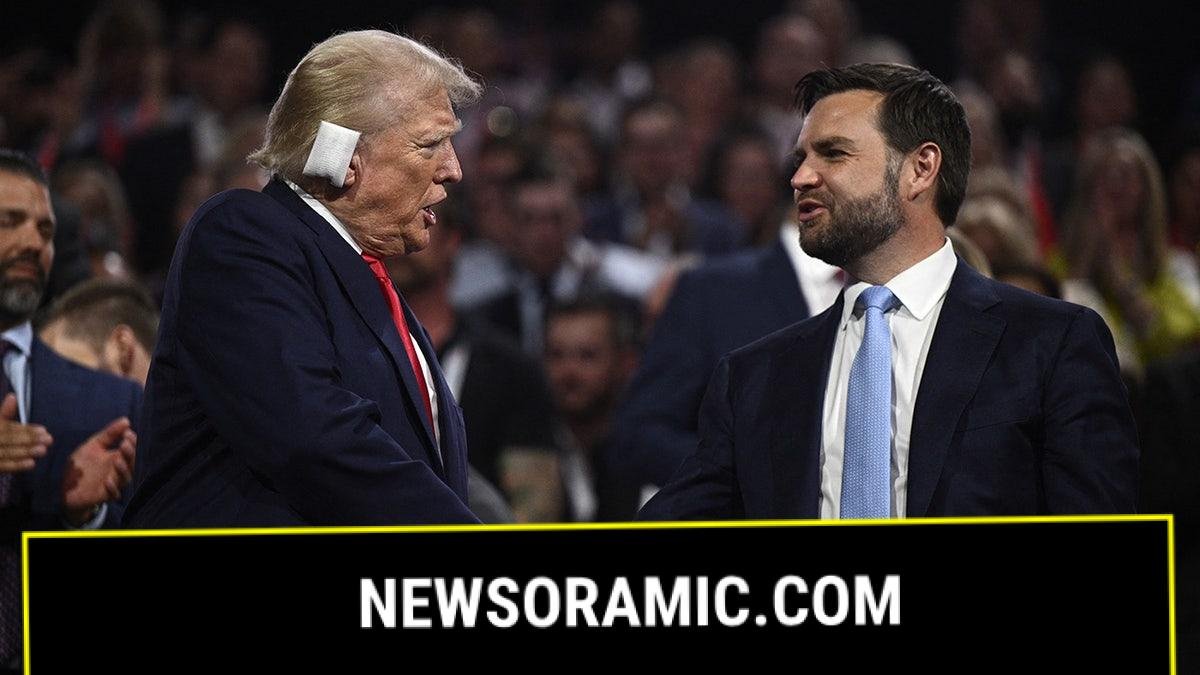 Donald Trump shakes hands with JD Vance