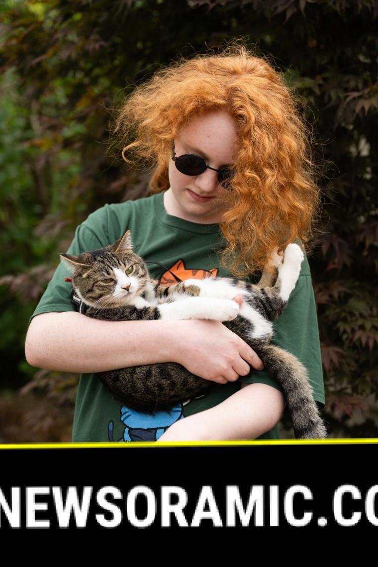 Adam with the family cat.