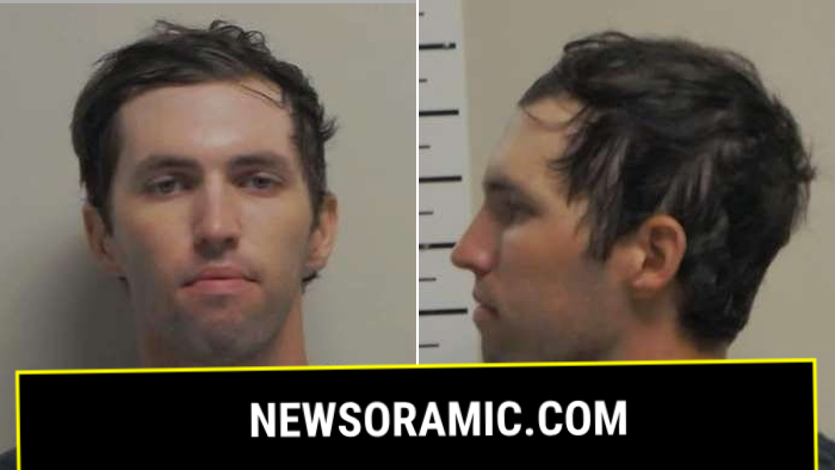 Tyler Robinson in a pair of mugshot photos, showing his portrait and profile. he has brown hair, hazel eyes, and a clean shave