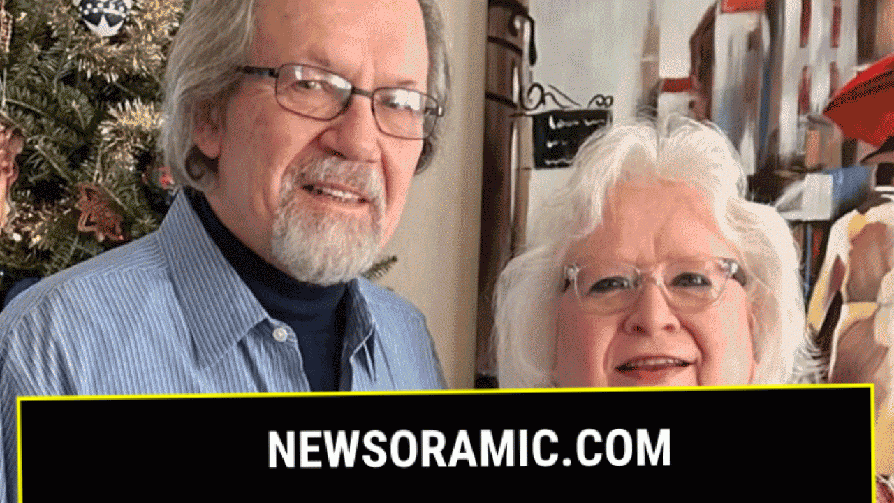 elderly couple posing for photo