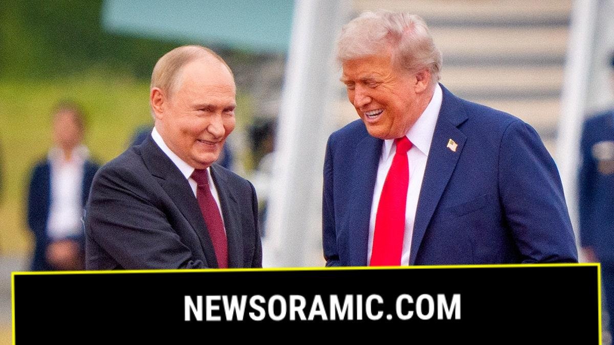 U.S. President Donald Trump shakes hands with Russian President Vladimir Putin