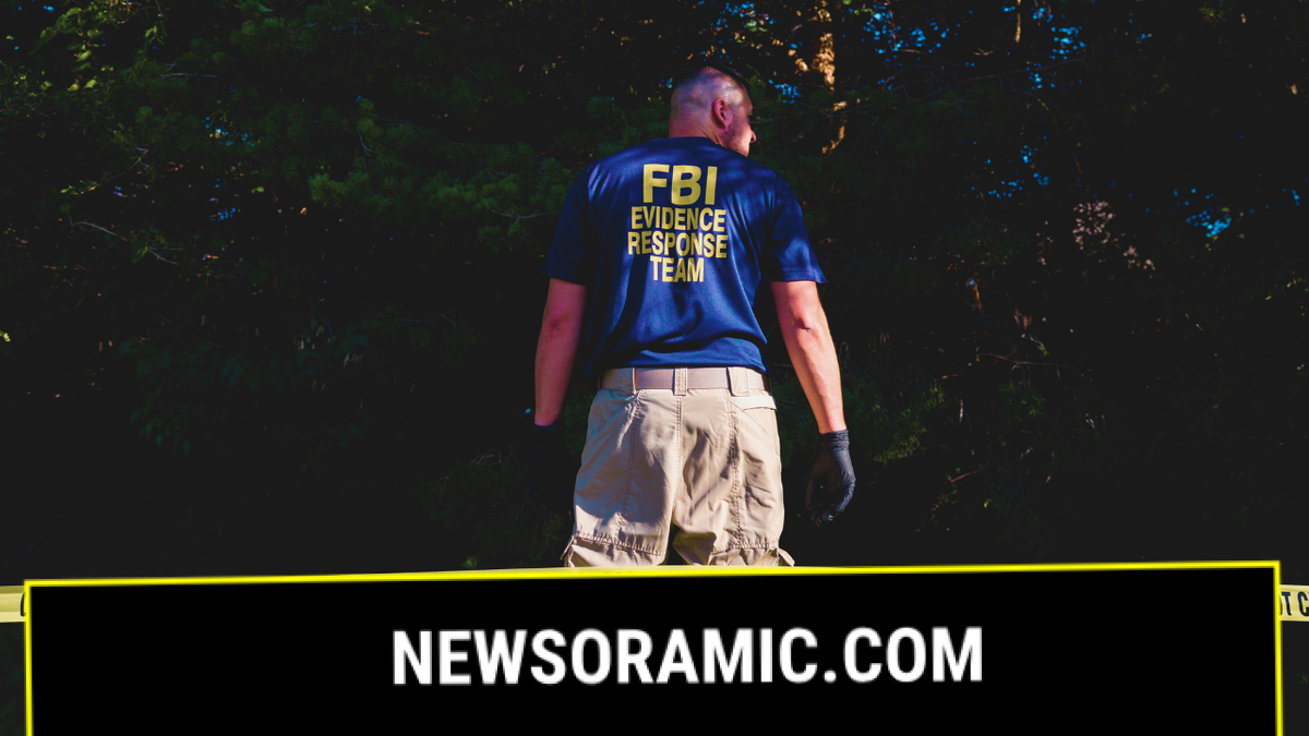 An FBI agent looks for evidence near Utah Valley University where Charlie Kirk was assassasinated