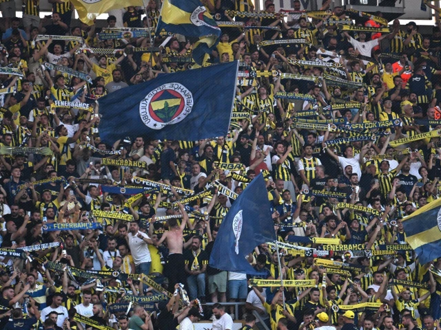 fenerbahce fans cheer for their team during the uefa champions league 3rd round second leg football match against feyenoord in istanbul on august 12 2025 photo afp