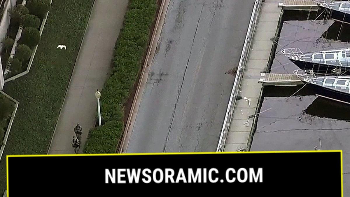 Armed officers patrol near Naval Academy waterfront during lockdown