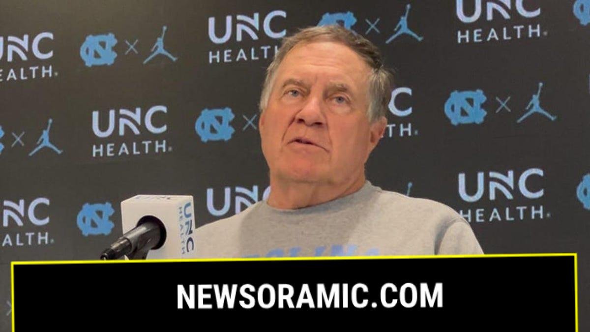 Bill Belichick looks out to reporters